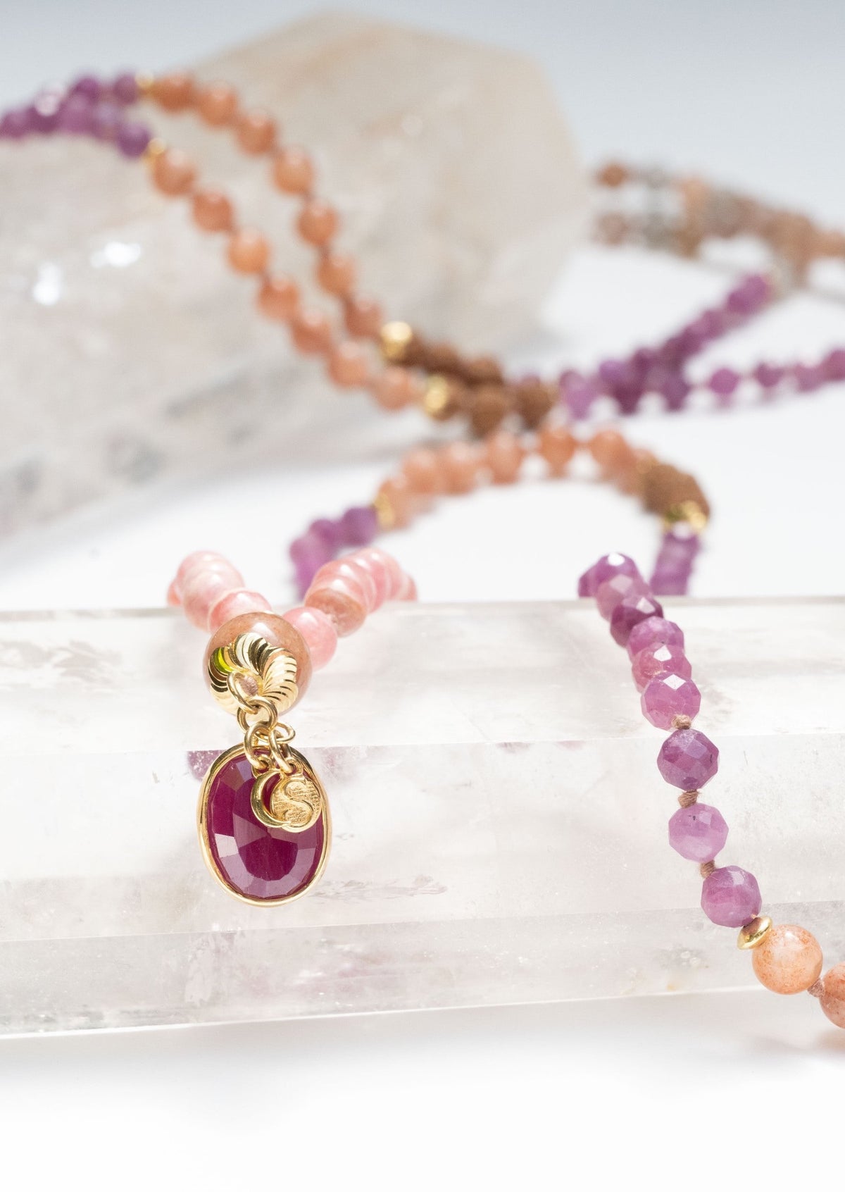 AMMA Woman of Light Ruby Mala with Rose Gold, Sunstone and Rhodochrosite.