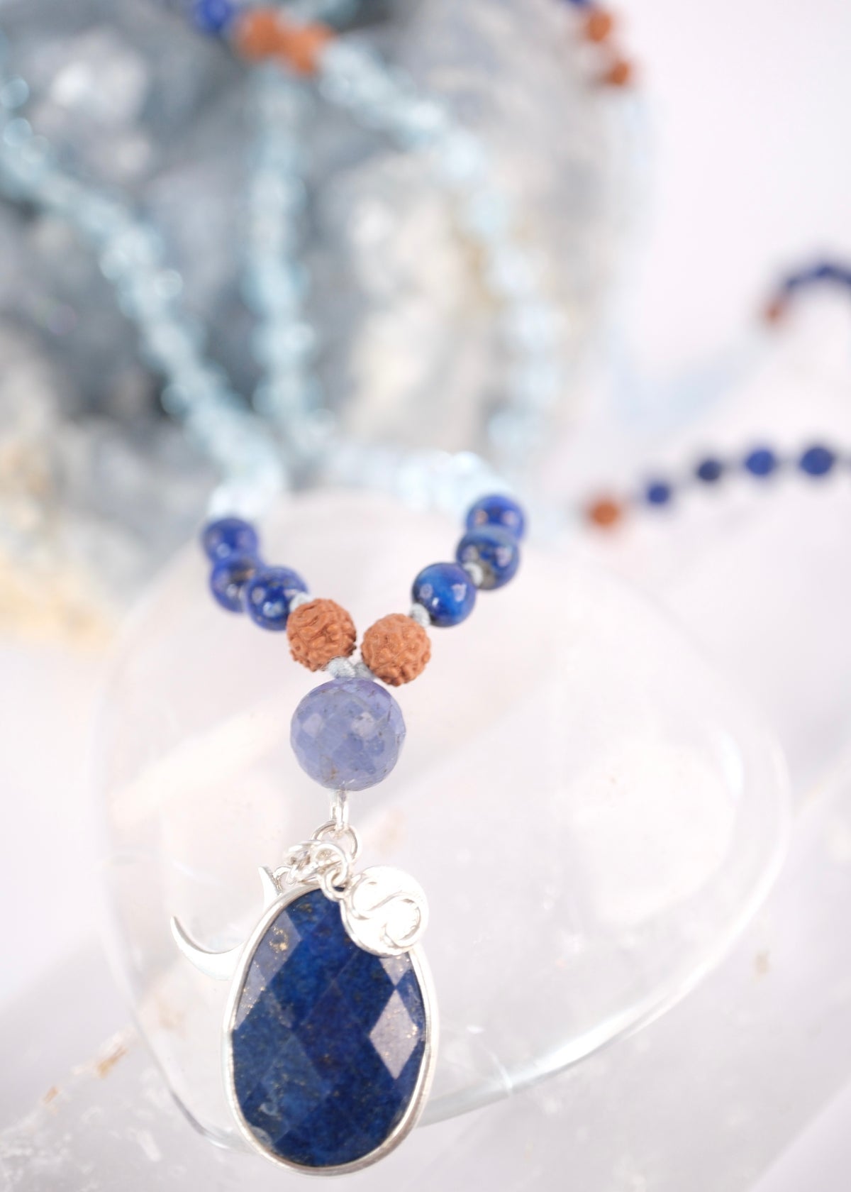 Faceted lapis lazuli pendant set in sterling silver on the Archangel Raphael mala
Lapis lazuli guru bead Iolite