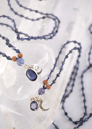brilliant iolite pendant on necklace of iolite beads