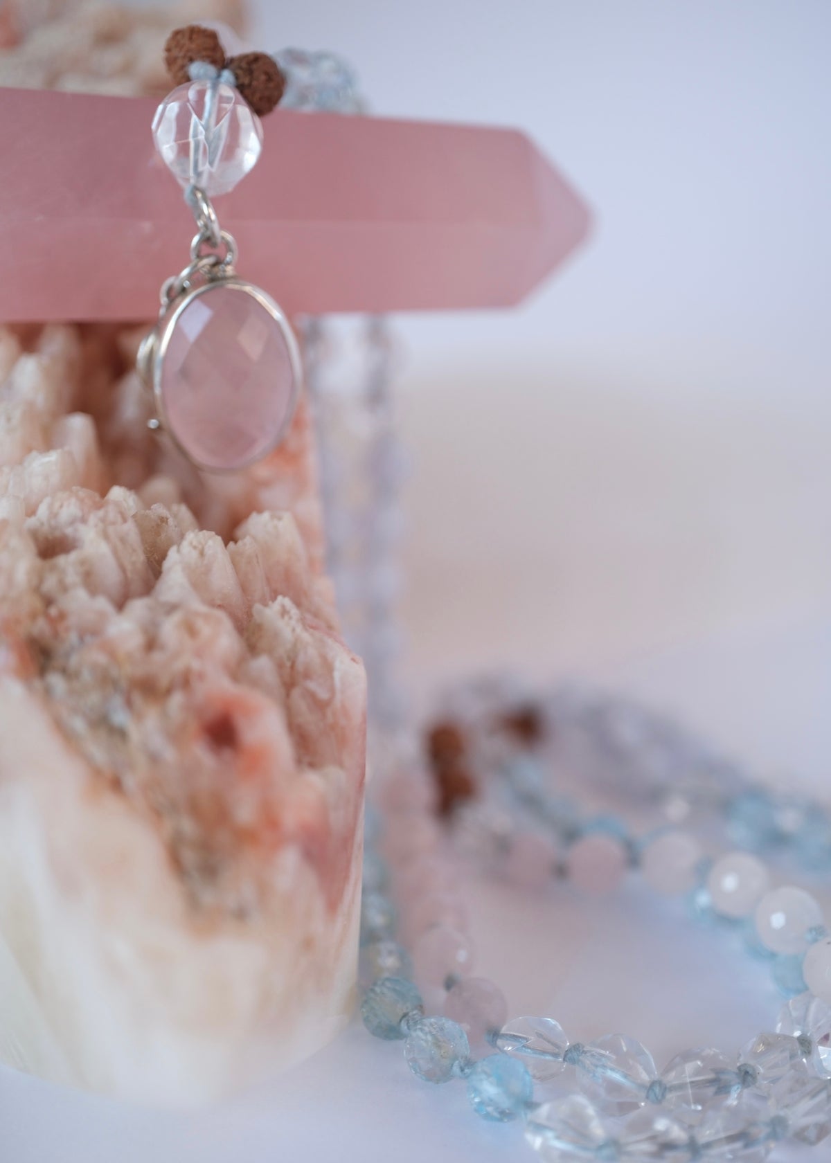 Double sided faceted rose quartz pendant set in sterling silver with Herkimer Quartz Bead