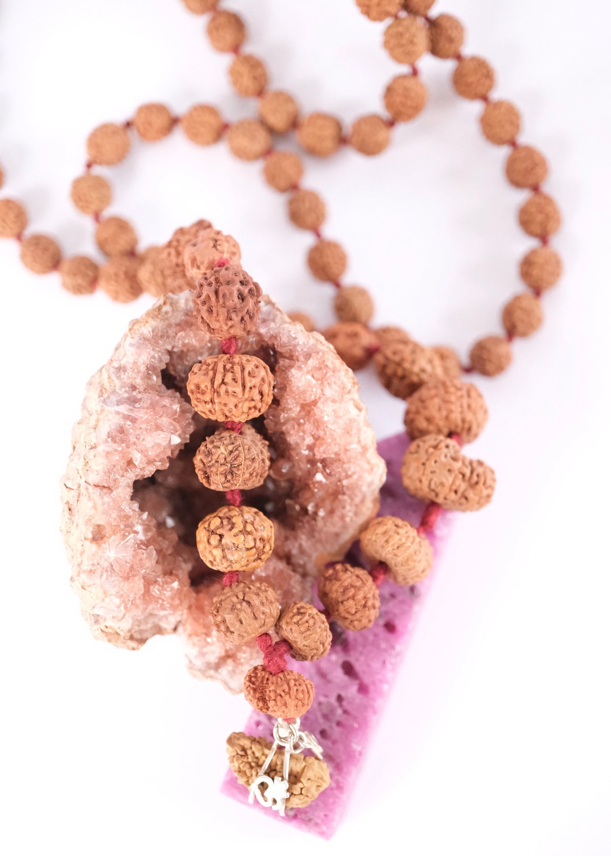Close view of the rare Gauri Shankar and Ganesh Rudraksha beads on the Sarva Siddha Mala.