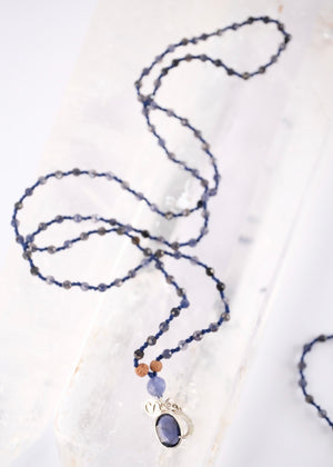 brilliant iolite pendant on necklace of iolite beads