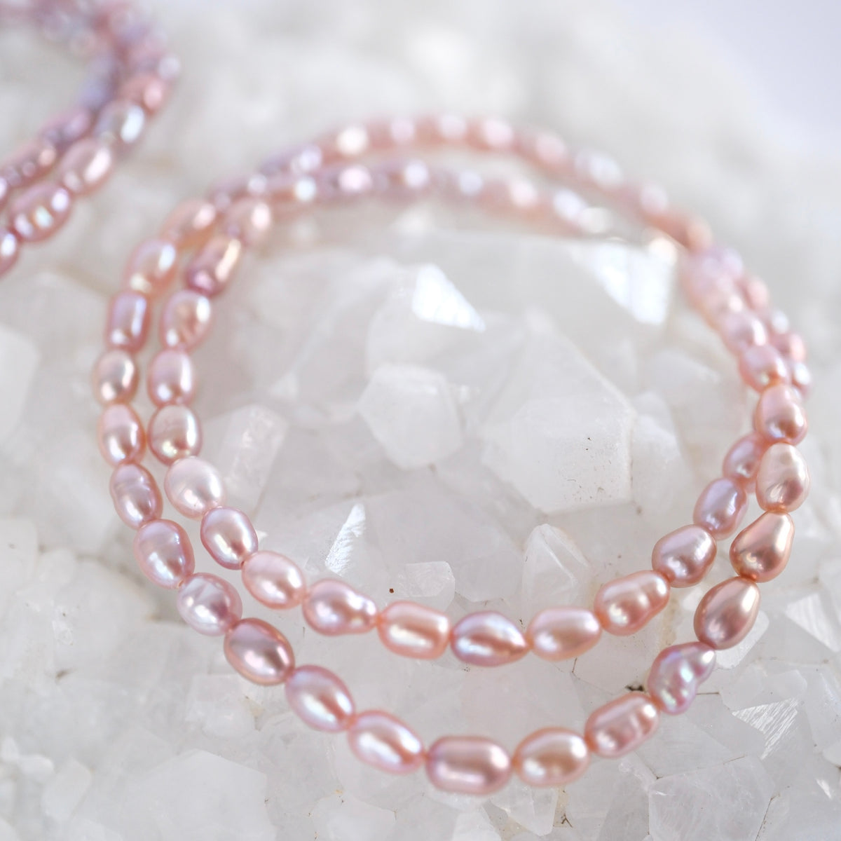 Grace of the Moon bracelet of lustrous Akoya pearls in soft pink, lilac, and apricot hues, handcrafted by Shivoham.