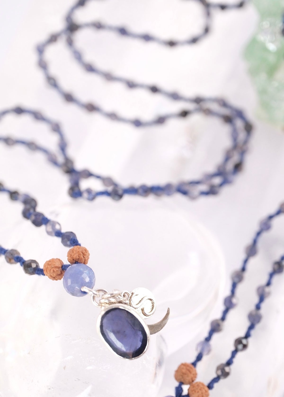 Deep blue faceted iolite prayer mala for intuition, inner vision, and soul connection, finished with a sterling silver iolite pendant.