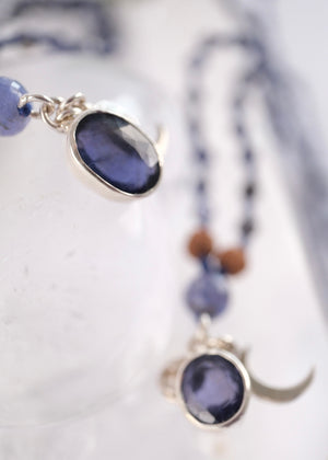 brilliant iolite pendant on necklace of iolite beads