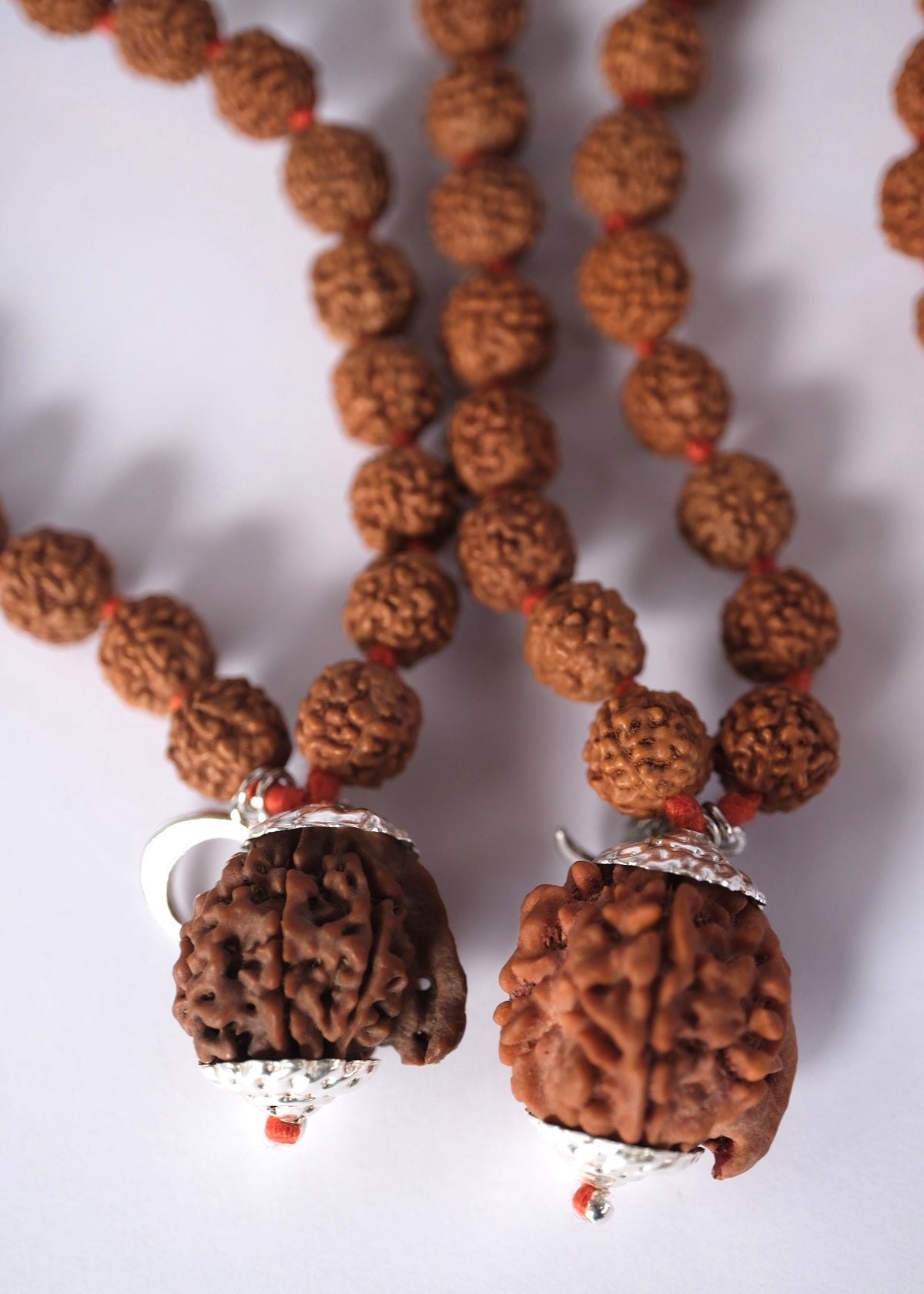 Close-up of Ganesha Rudraksha guru bead with sterling silver caps