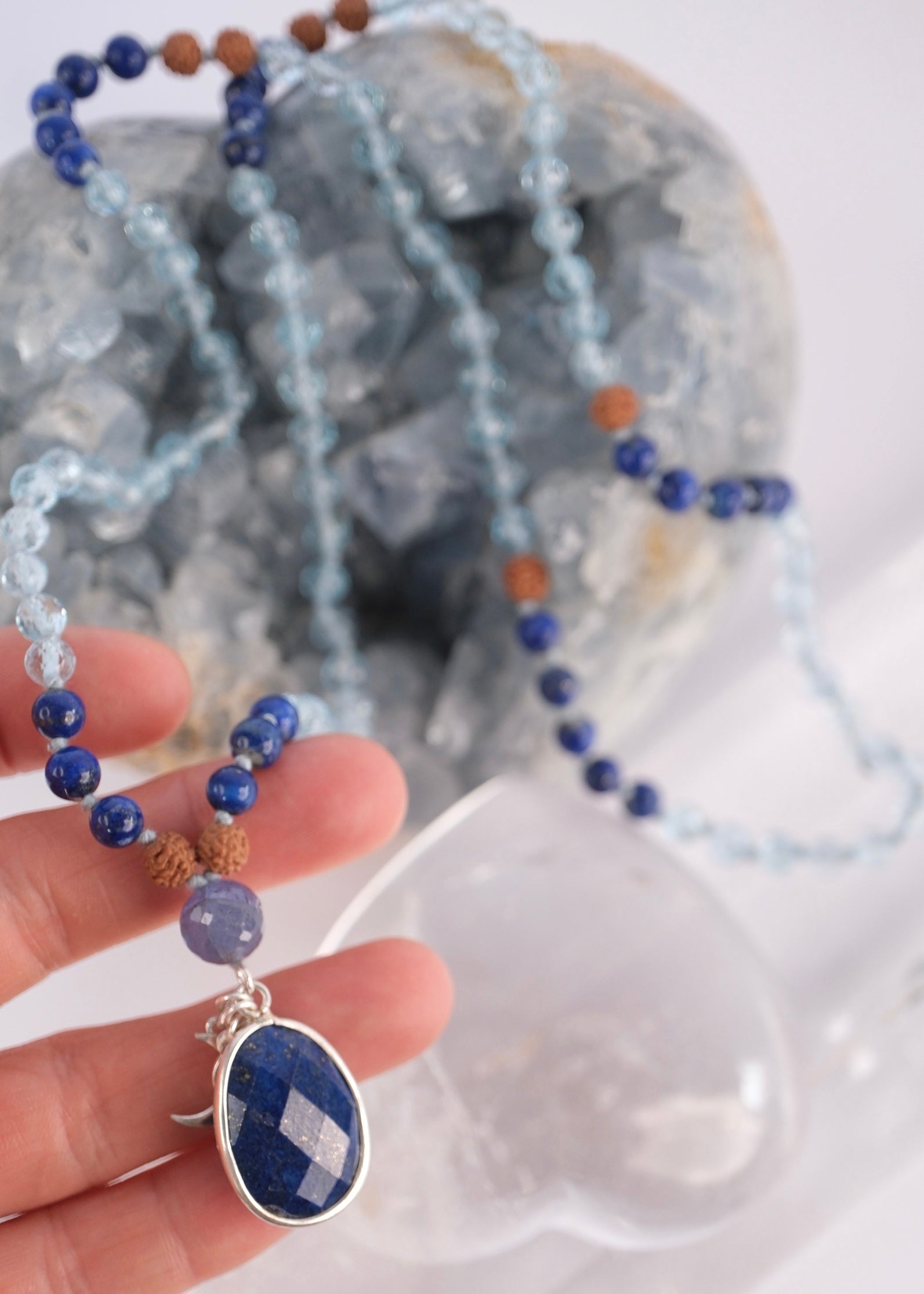Faceted lapis lazuli pendant set in sterling silver on the Archangel Raphael mala