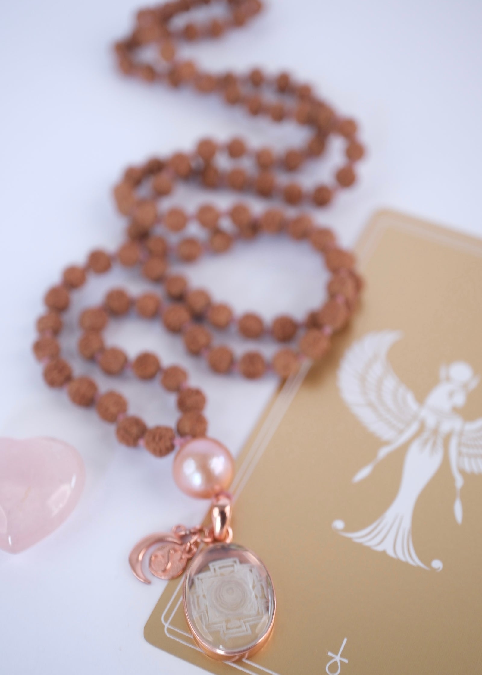 Rudraksha Mala with Sri Yantra pendant and pink Akoya petal Giri bead