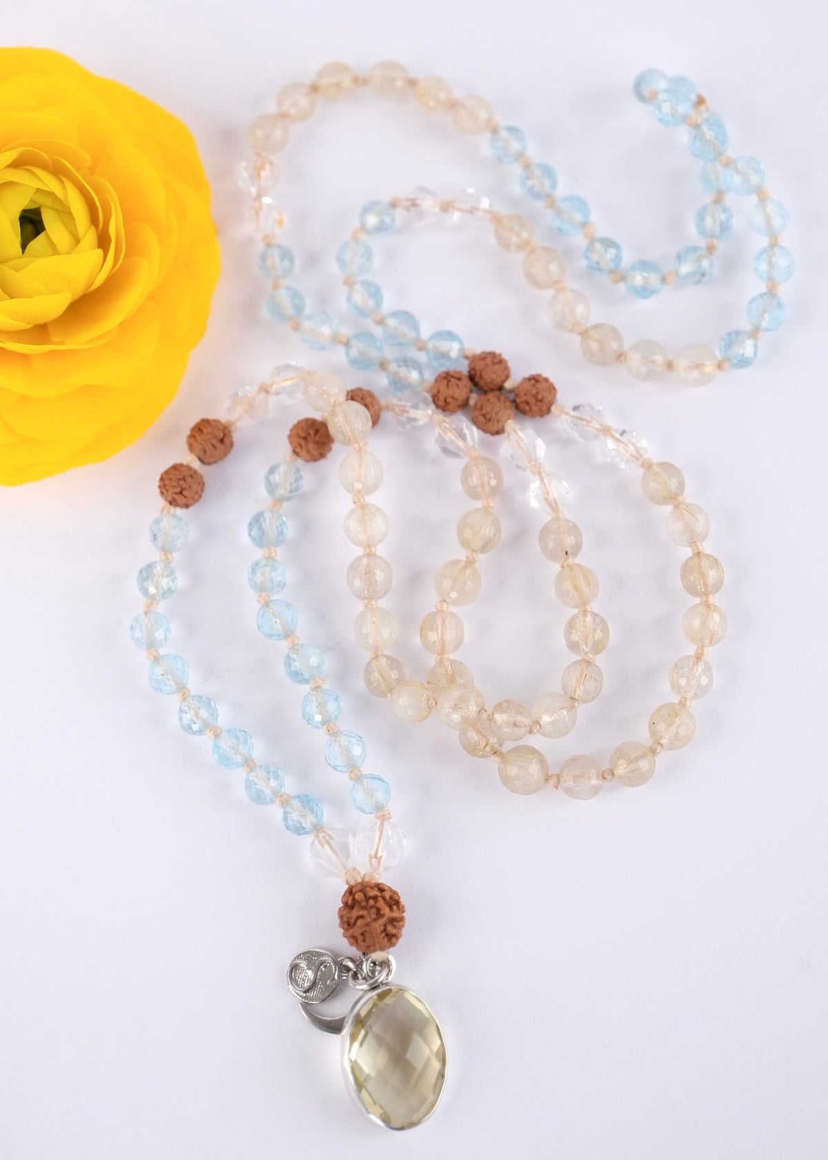 Serene blue topaz, Golden Rutile Quartz and Herkimer quartz mala for meditation and soothing spiritual energy, grounded with sacred Rudraksha