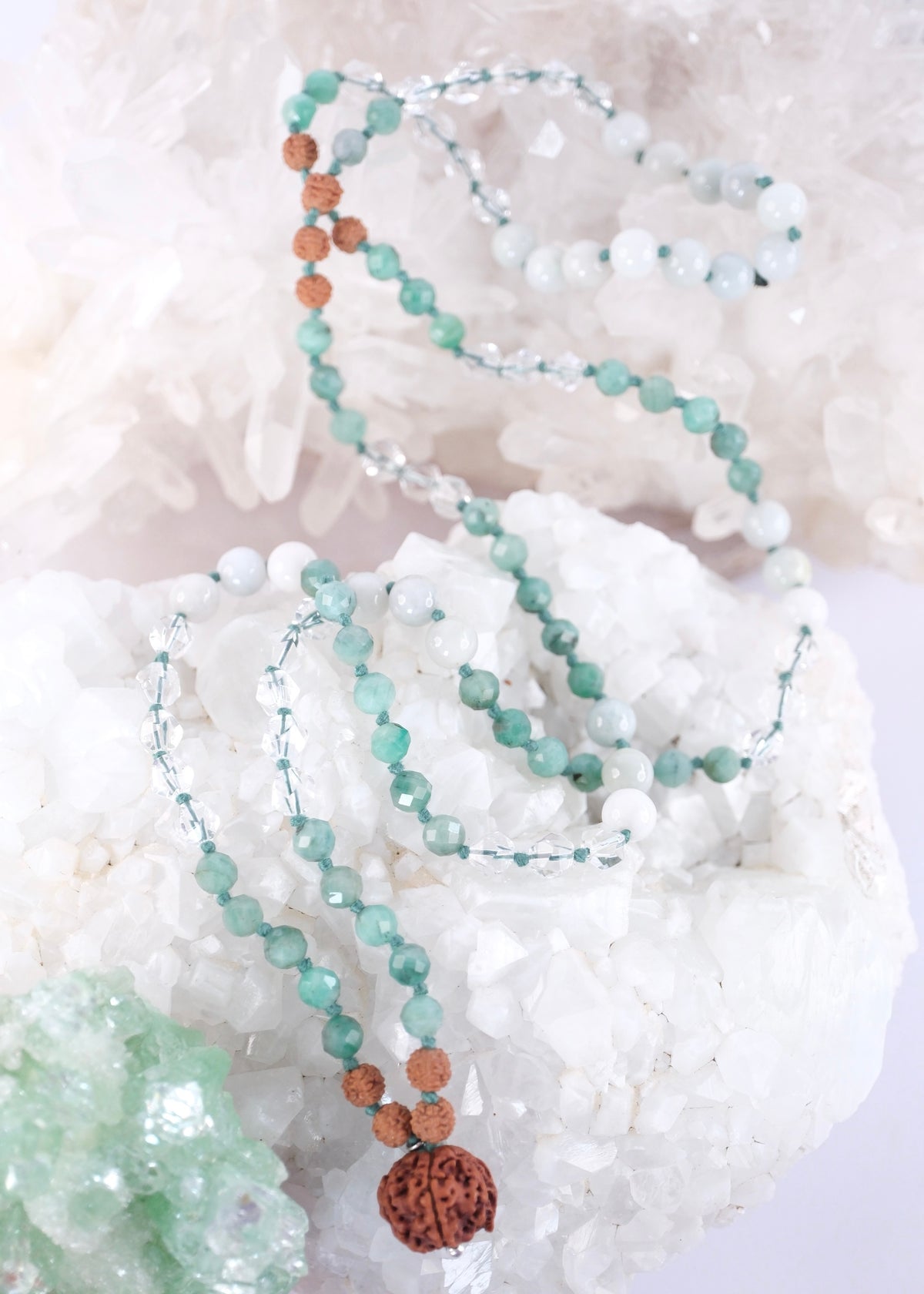 Soft green jade and faceted emerald prayer mala for heart healing, luck, and abundance, finished with Herkimer style quartz.