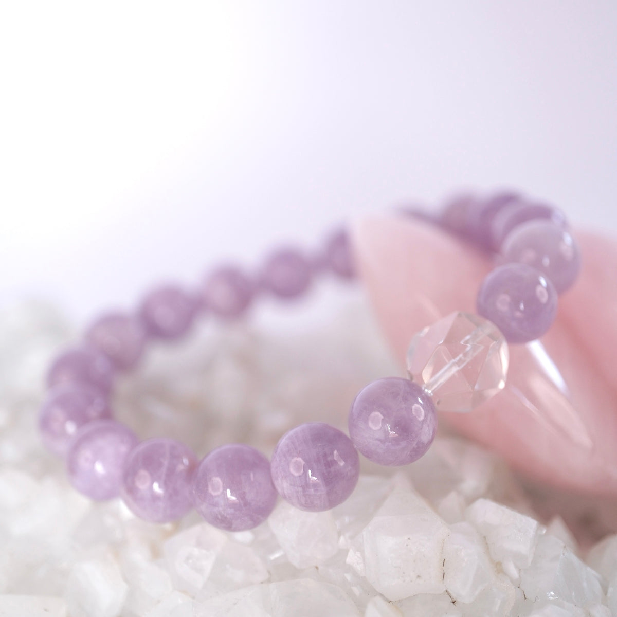 Amrita bracelet of soft lavender quartz with a single Herkimer diamond, for calm, peace, and gentle grace.