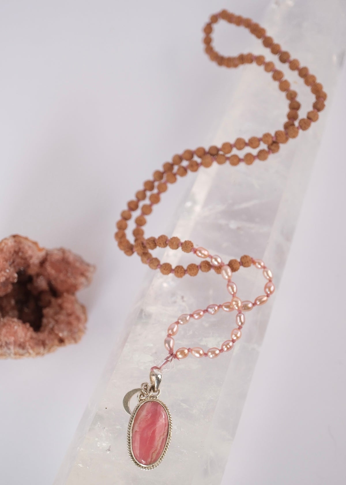 Madhurya mala with deep pink rhodochrosite pendant, small Rudraksha and pink Akoya pearls. Divine Live energy