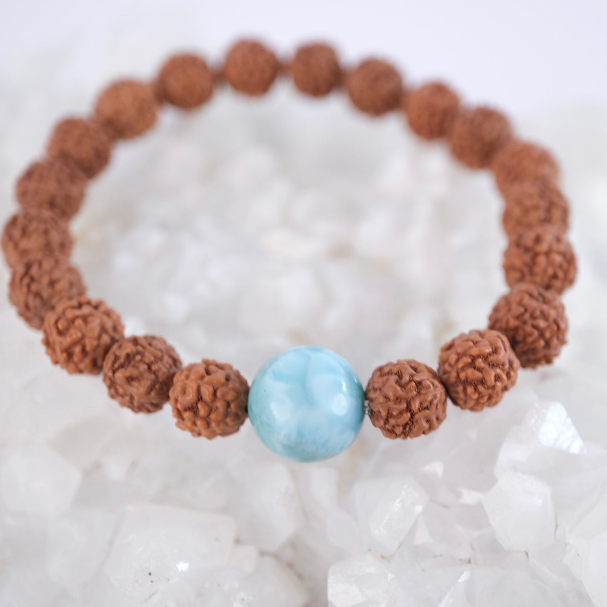 Close view of a high grade Larimar bead and five mukhi Rudraksha on the Satya Vani bracelet.