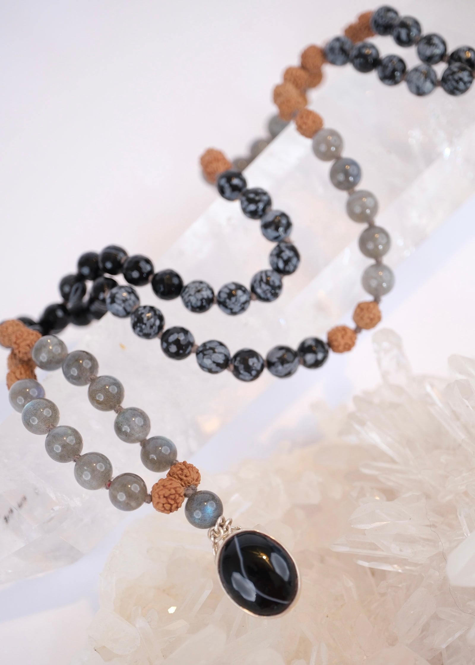 Beaded necklace with black onyx pendant on beautiful quartz crystal