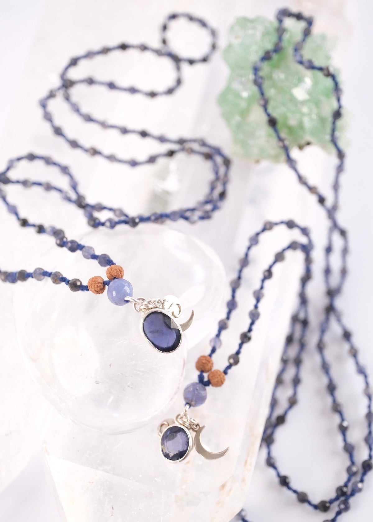 Handcrafted double knotted iolite malas with Rudraksha and a tanzanite guru bead, blessed by Ma Ganga, a matched pair for two soulmates.
