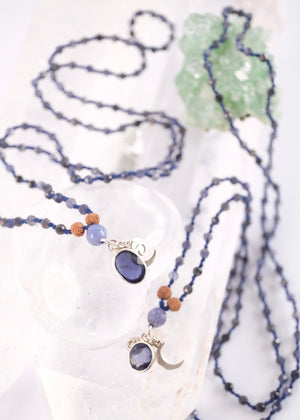 brilliant iolite pendant on necklace of iolite beads