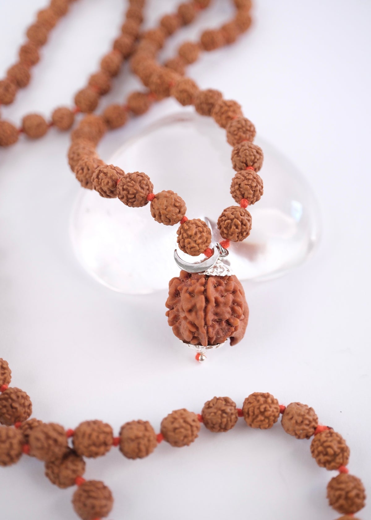 Eight millimetre five mukhi Rudraksha beads on a handcrafted Ganesh japa mala