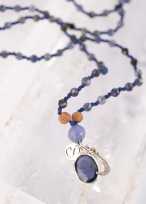brilliant iolite pendant on necklace of iolite beads