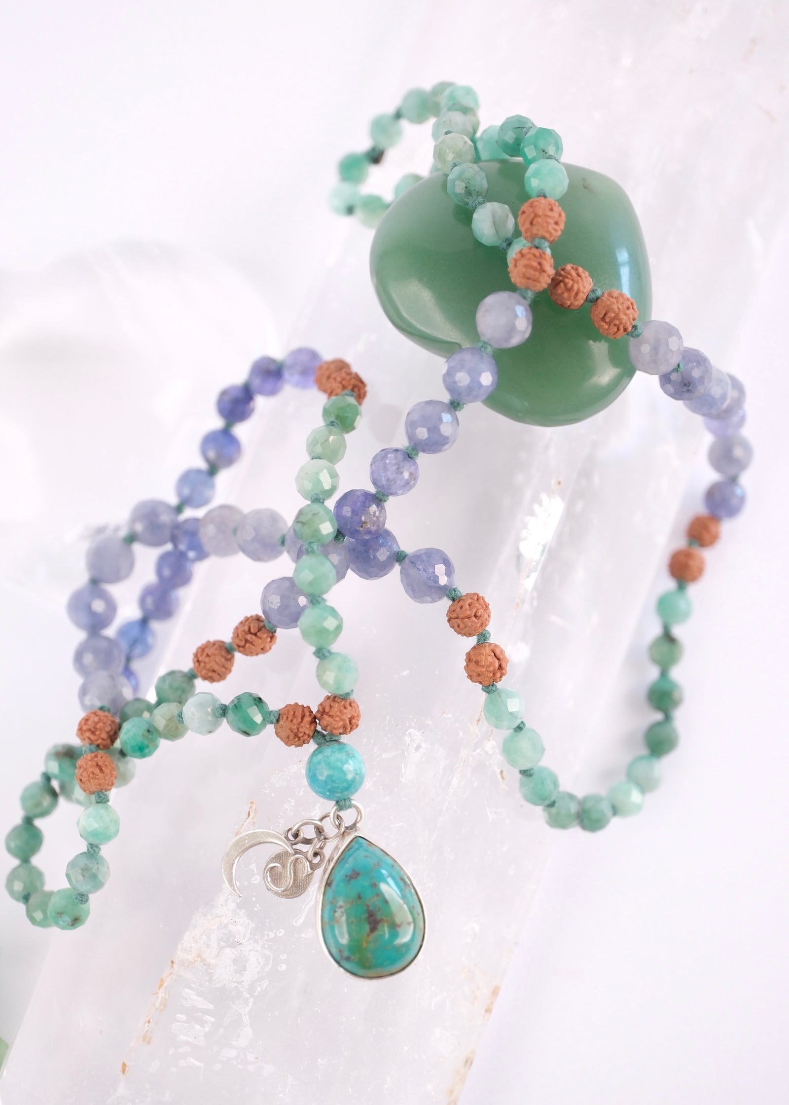 Abhyudaya mala with faceted emerald, tanzanite, iolite and old mine Persian turquoise teardrop pendant