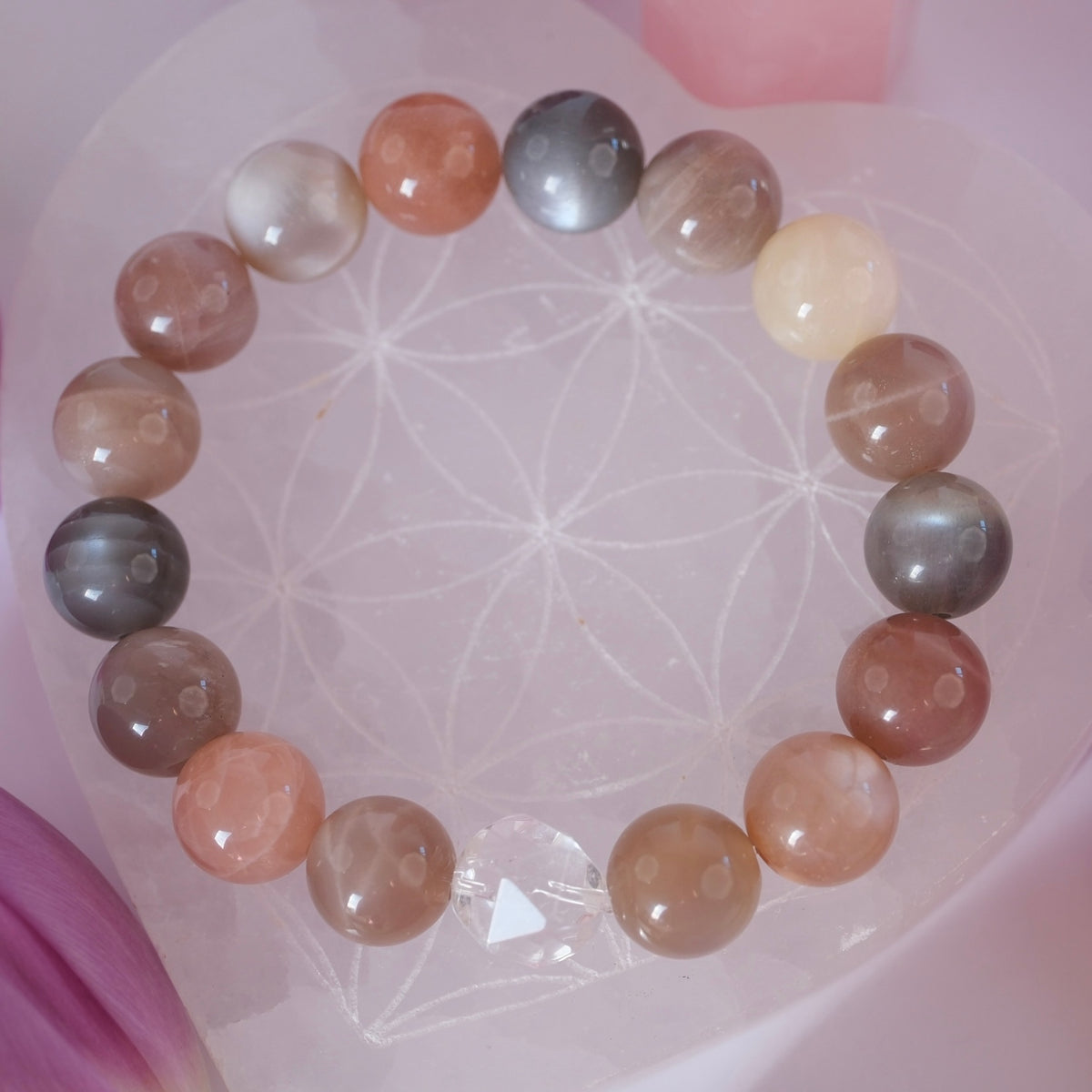 Multi hued moonstone bracelet with a bright Herkimer diamond, handcrafted and blessed by Ma Ganga.