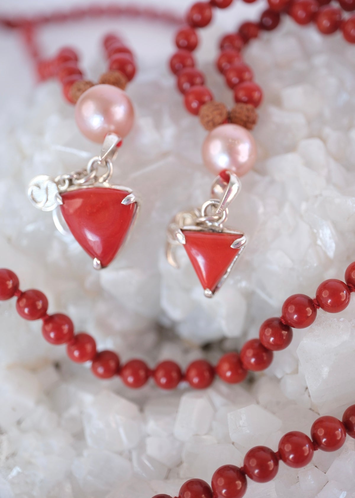 Two Italian Red Coral Pendants in Moomba shoe with Pink Akoya Pearl as Guru bead on Taiwanese Red Coral Mala