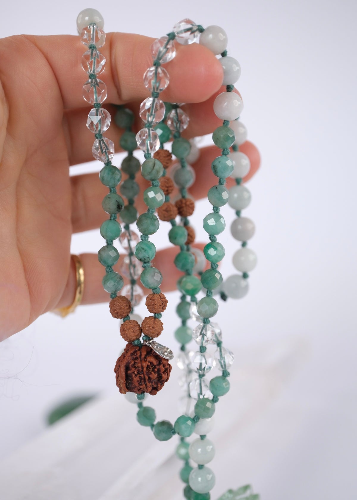Riddhi mala of vibrant fortune with Handcrafted green jade and emerald mala with Rudraksha and a Ganesh guru bead, knotted with mantra and blessed by Ma Ganga.