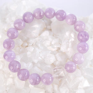 Gentle lilac quartz and Herkimer bracelet soft, serene, and uplifting. ON selenite heart and surrounded by flowers