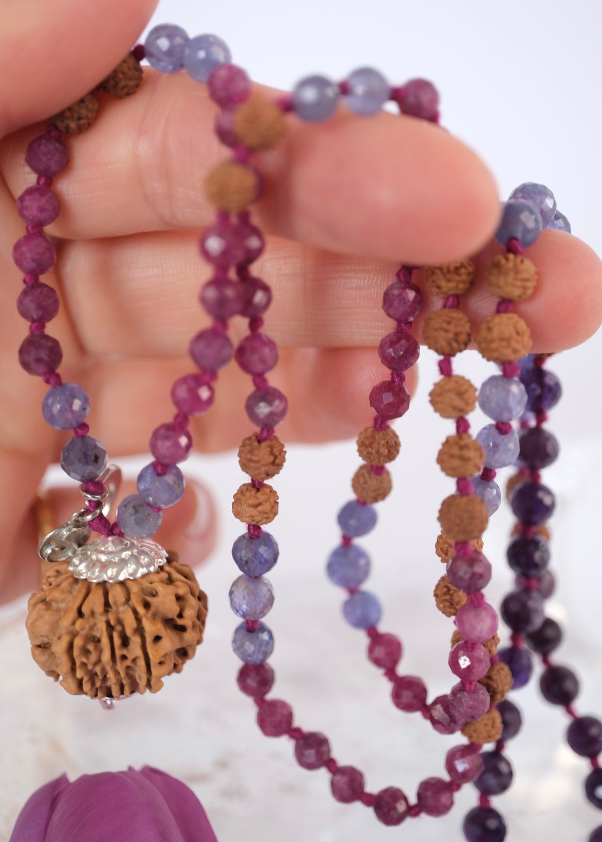 Close up of hand holding Durga Mala