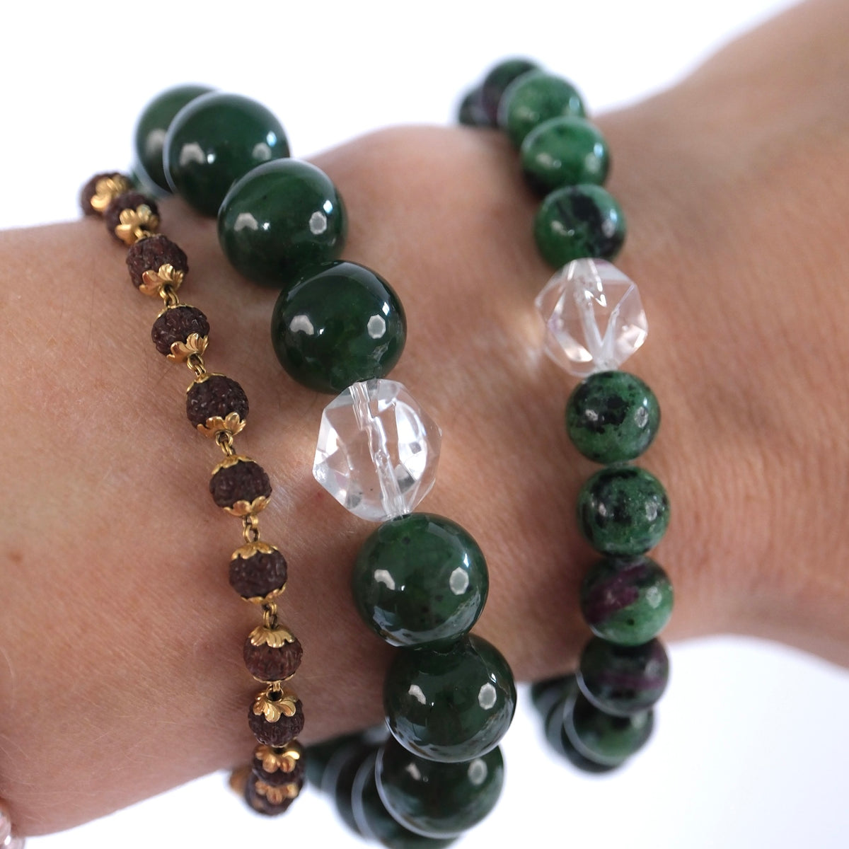 Green nephrite jade bracelet for good fortune, protection, and calm, worn at the wrist.