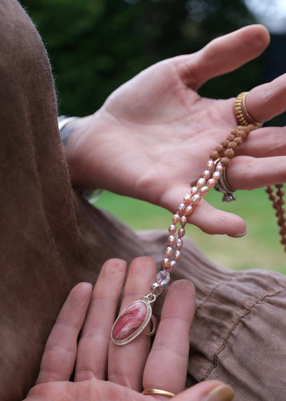Woman holding beautiful Mala