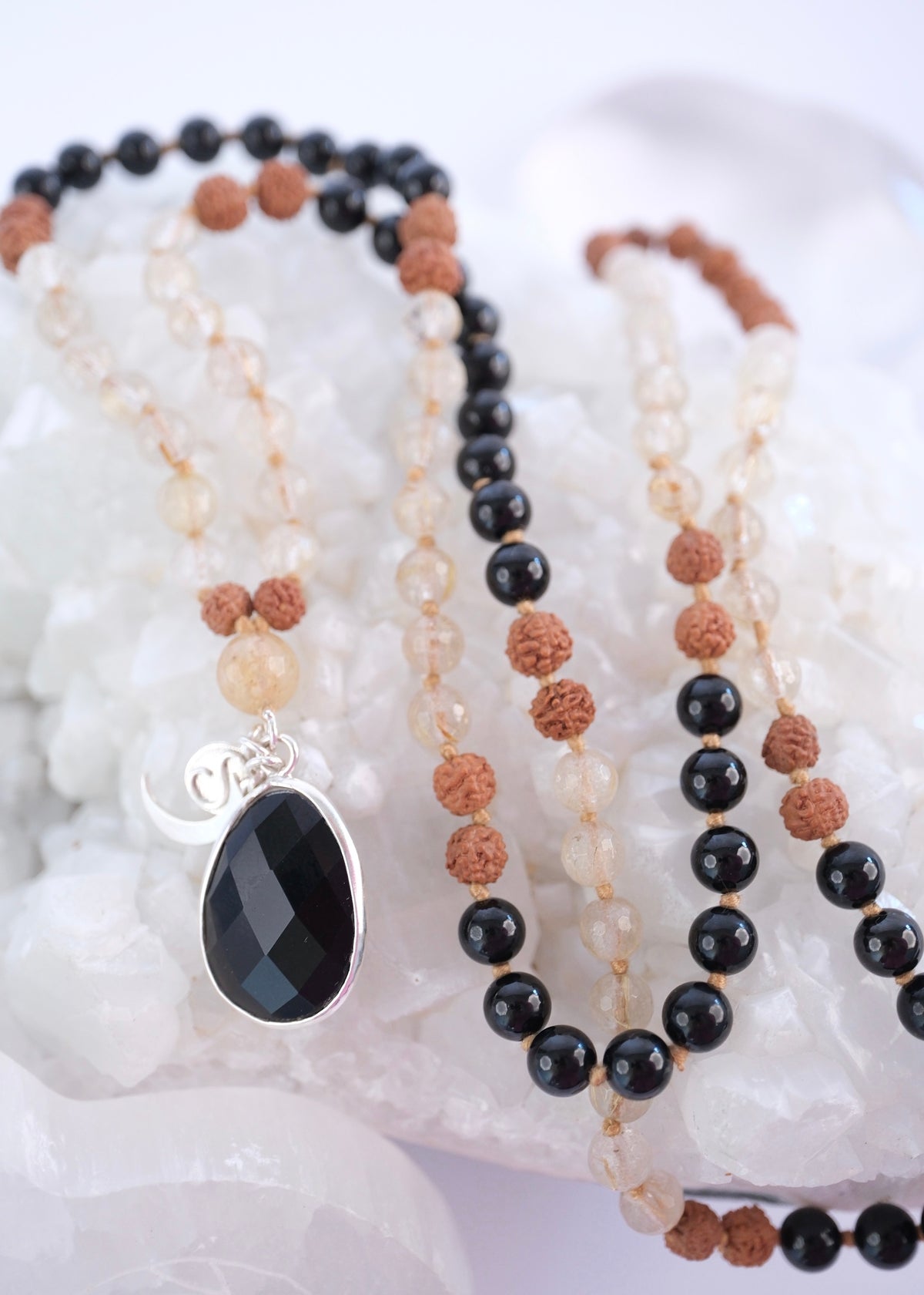 Tantrika mala with faceted black tourmaline pendant and golden rutilated quartz
