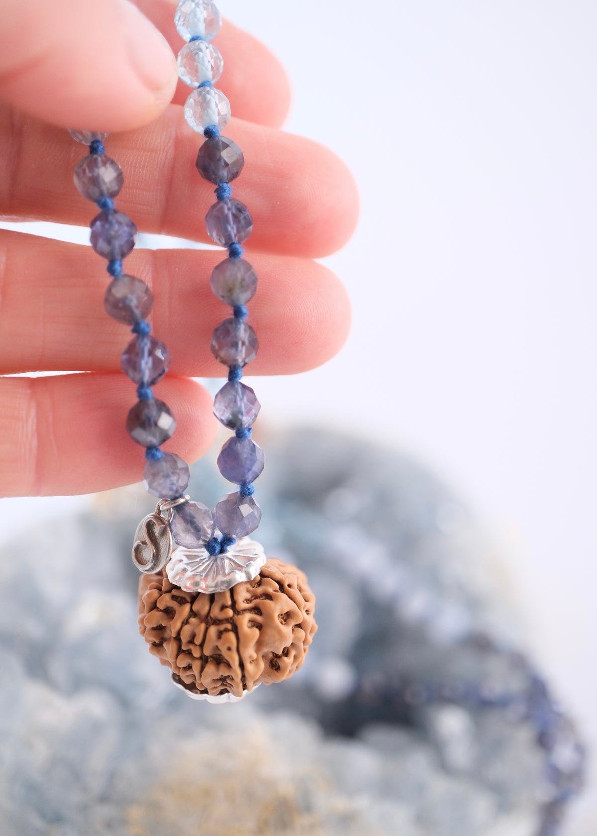 Faceted Iolite beads and 10 mukhi with sterling silver charms