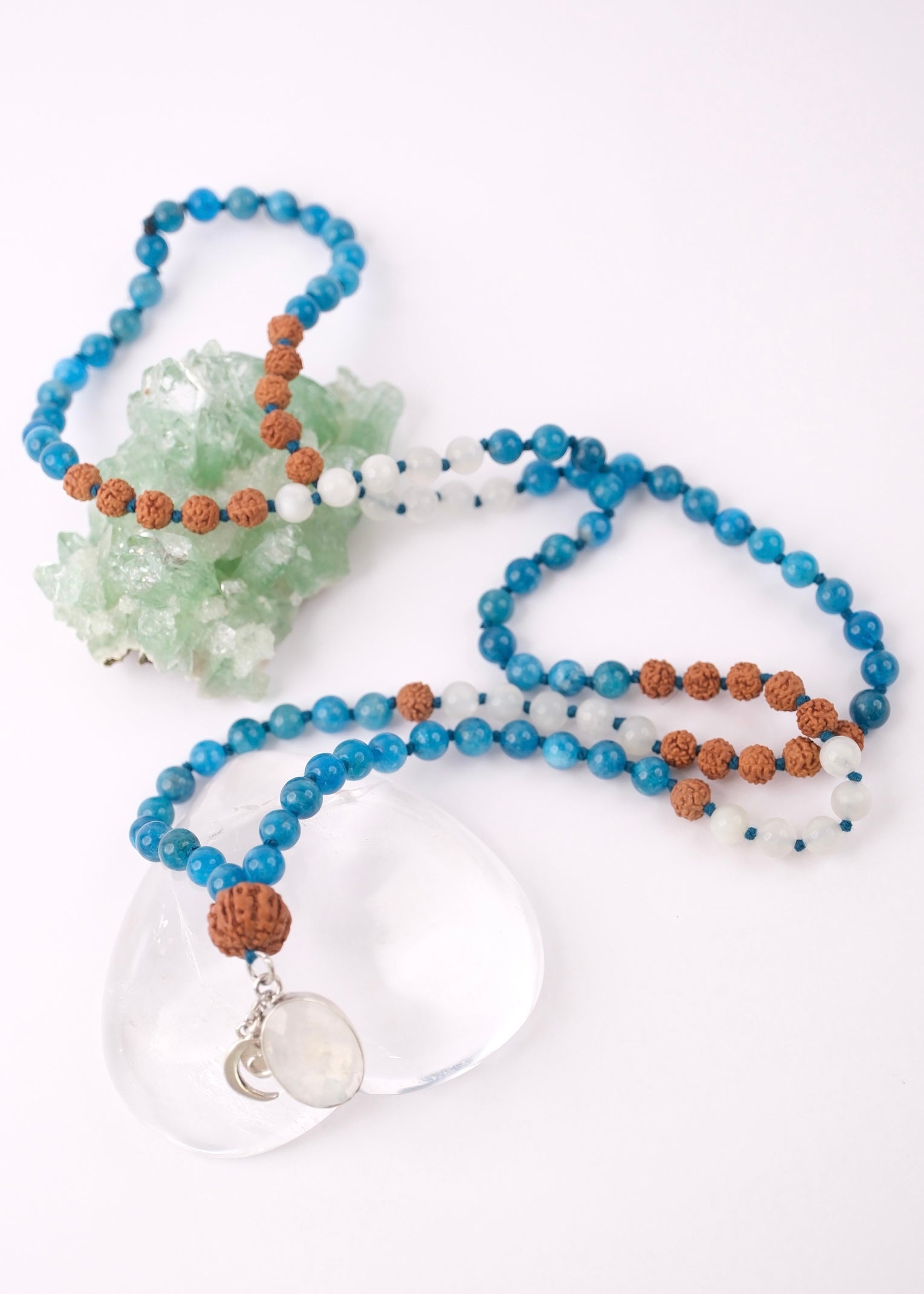 Mala Beads with Apatite, Moonstone, 5 Mukhi Rudraksha, and solid Shivoham 925 Sterling Silver. Crowned by a stunning rainbow moonstone pendant