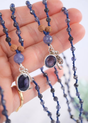 brilliant iolite pendant on necklace of iolite beads