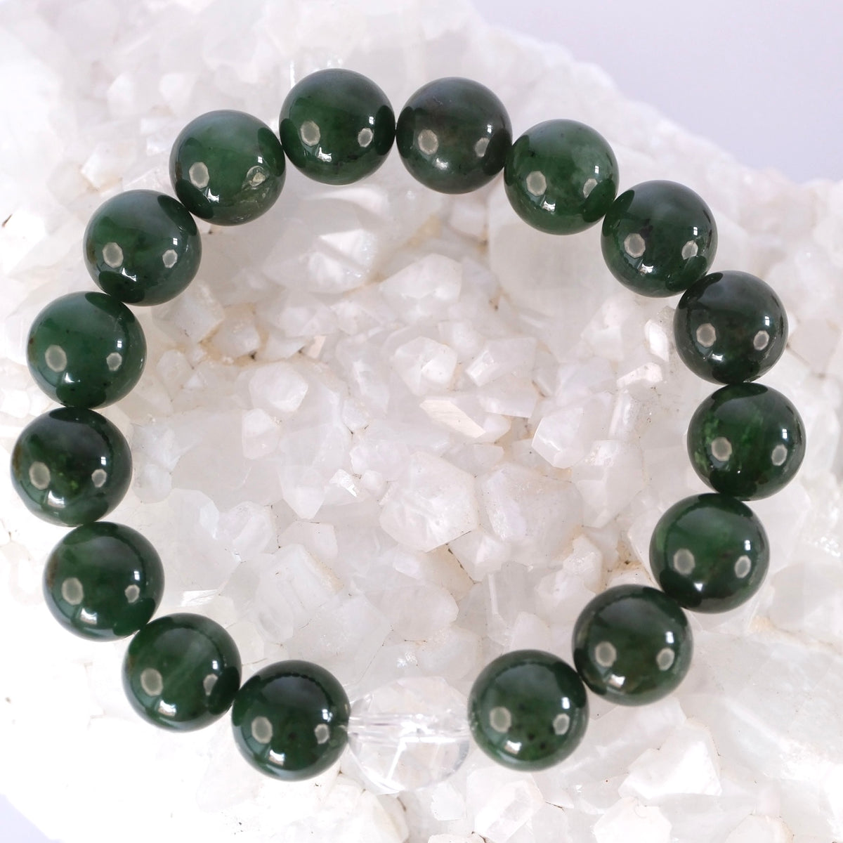 Forest green jade and clear quartz bracelet, handcrafted and blessed by Ma Ganga, for prosperity and serenity.