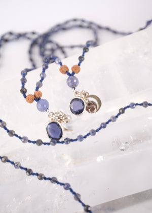 brilliant iolite pendant on necklace of iolite beads