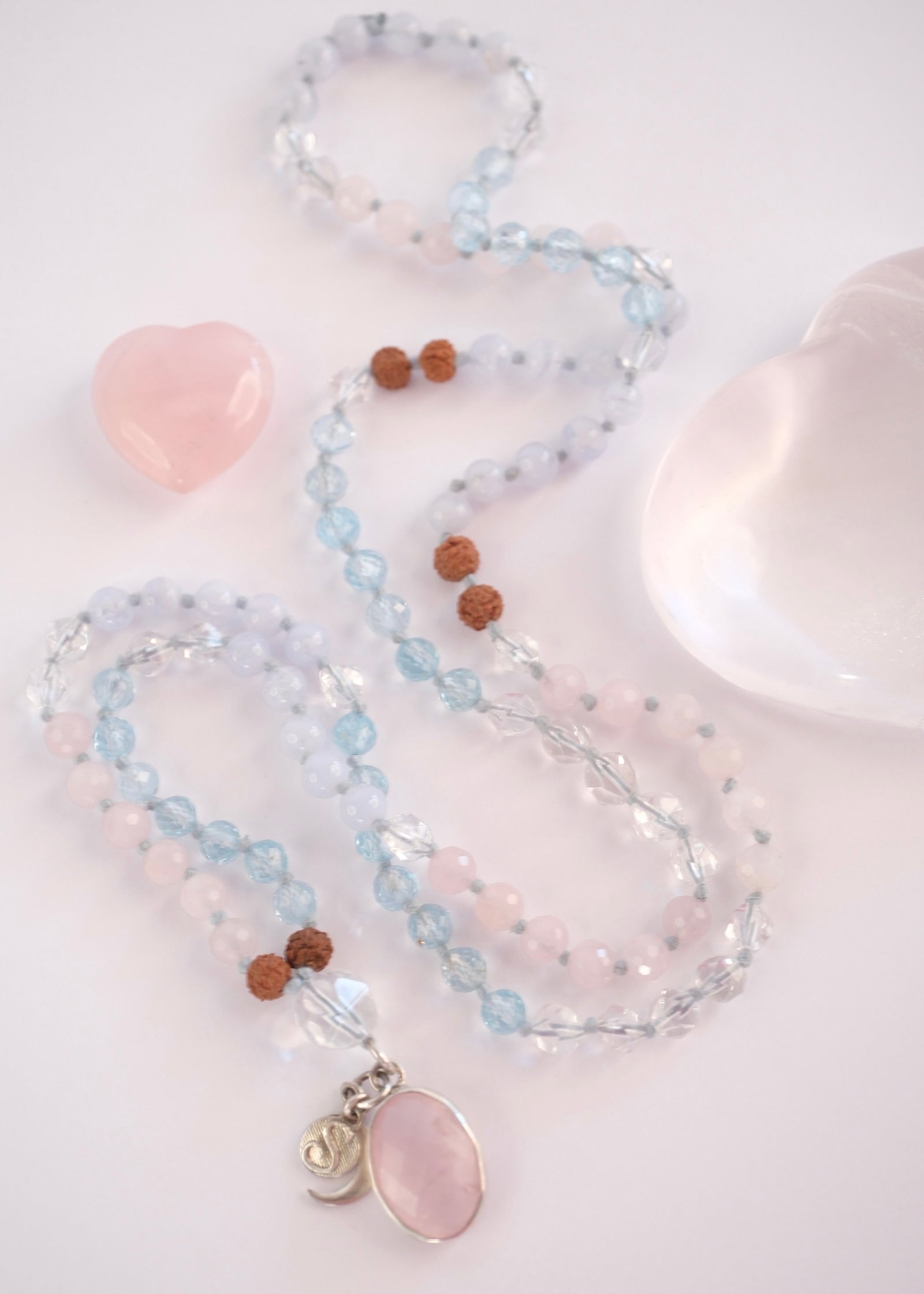 Prema Shanti mala with faceted rose quartz pendant and topaz and Herkimer beads