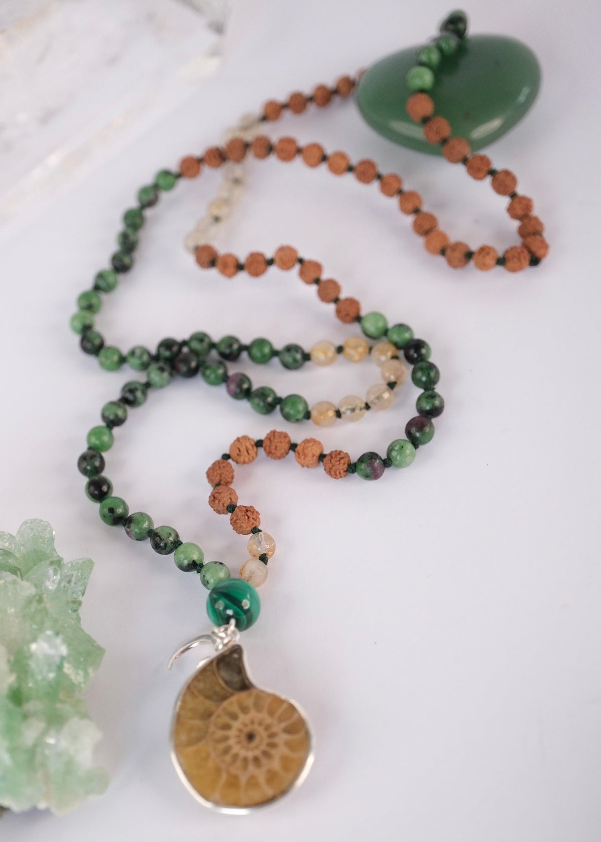 Siddha Maya seer’s mala with ammonite spiral pendant, ruby zoisite, rutilated quartz and malachite