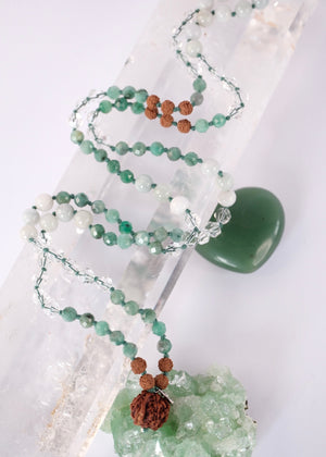 Close up of Emerald Mala with Ganesh Guru bead, herkimer and green jade