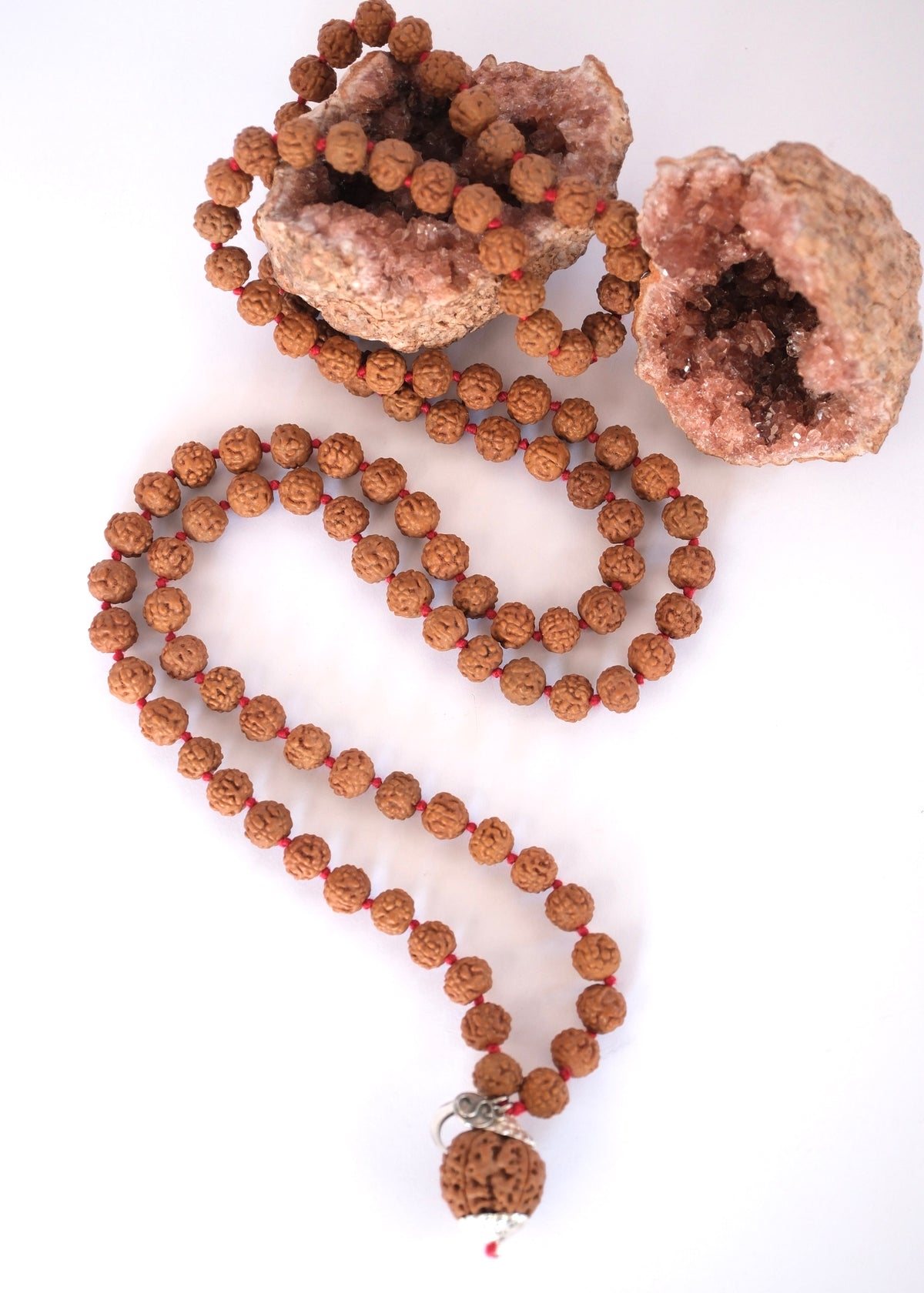 SHIVOHAM 108-bead Nepal Rudraksha Japa Mala arranged in a sacred circle symbolizing infinite spiritual practice.