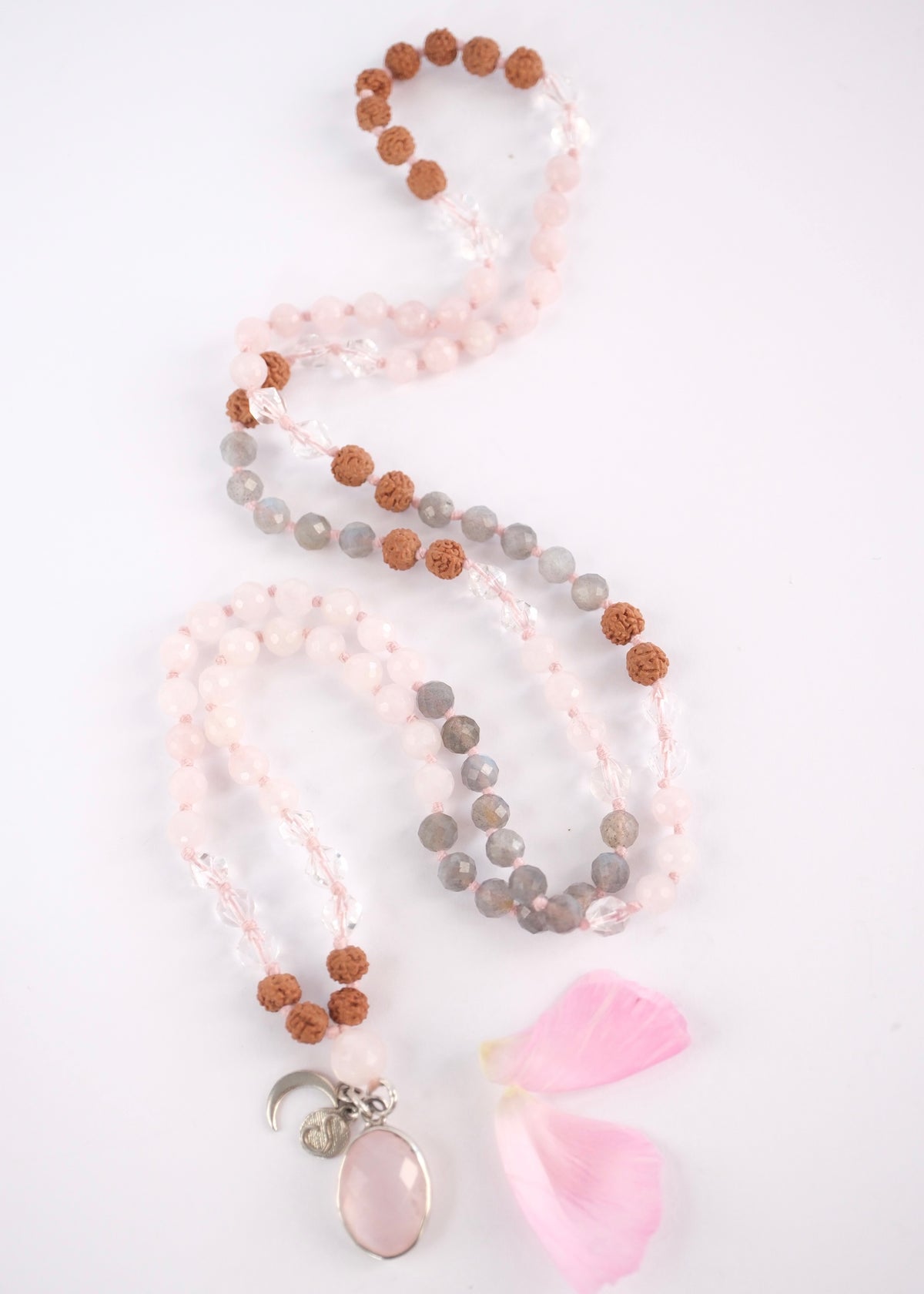 Bodhimata mala with rose quartz pendant, labradorite and Rudraksha beads
Soft rose quartz pendant and eight millimetre rose quartz guru bead on the Bodhimata mala
Faceted labradorite and Madagascan rose quartz beads on the rose quartz love mala