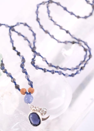 brilliant iolite pendant on necklace of iolite beads