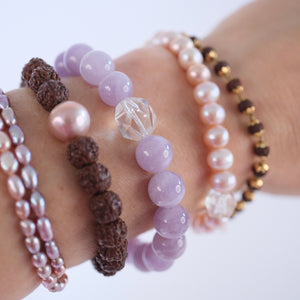 Gentle lilac quartz and Herkimer bracelet soft, serene, and uplifting. ON selenite heart and surrounded by flowers