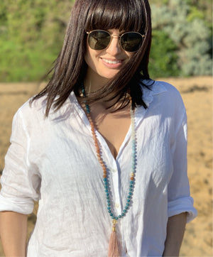 Women in Shivoham Mala Beads