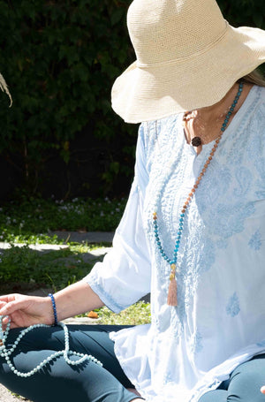 Women in Shivoham Mala Beads